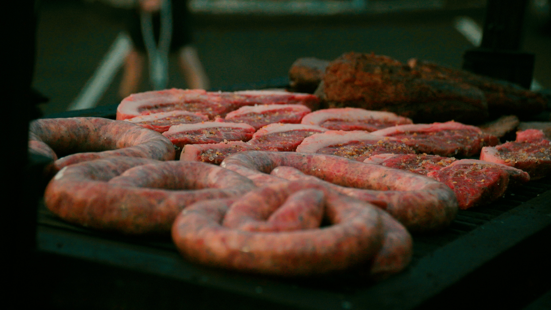 Brazilian thick sausage on grill